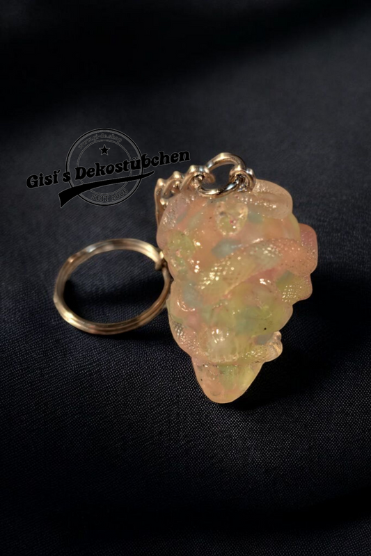 Leuchtender Totenkopf mit Schlangen