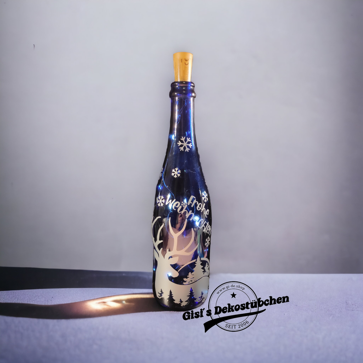 Frohe Weihnachten beleuchtete Flasche