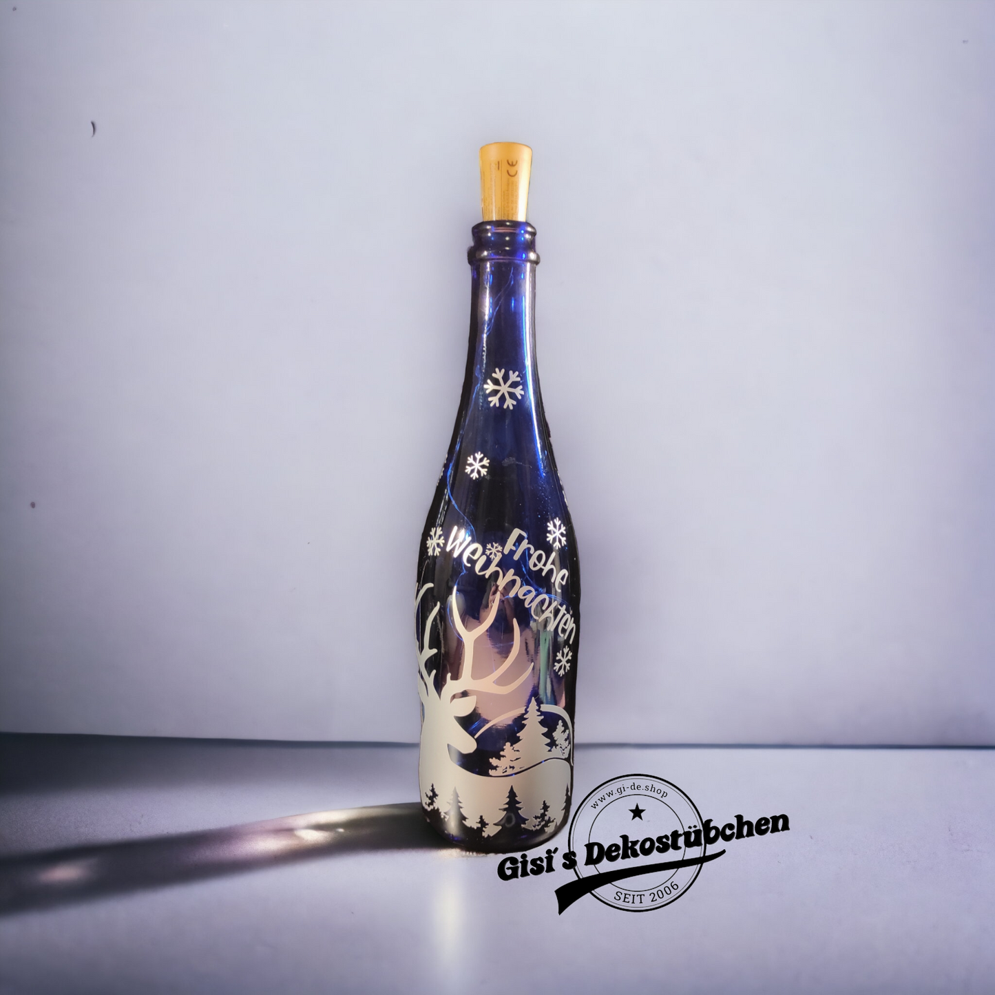 Frohe Weihnachten beleuchtete Flasche