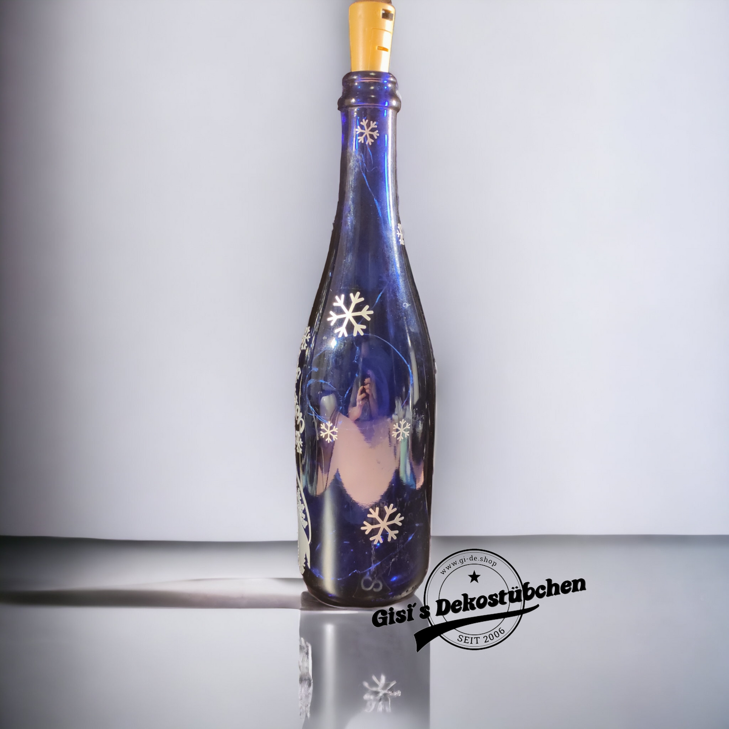 Frohe Weihnachten beleuchtete Flasche