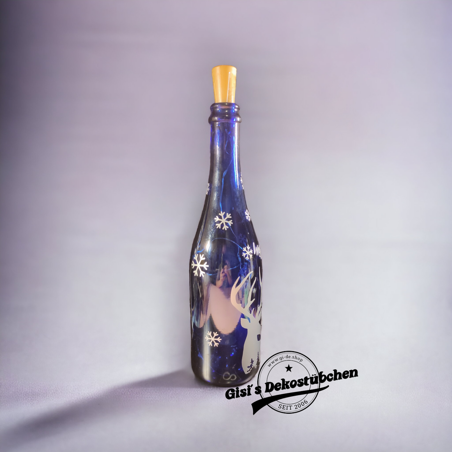 Frohe Weihnachten beleuchtete Flasche